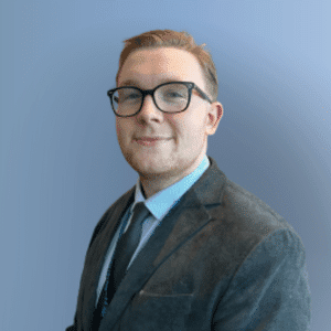 Finlay headshot, blue grey background
